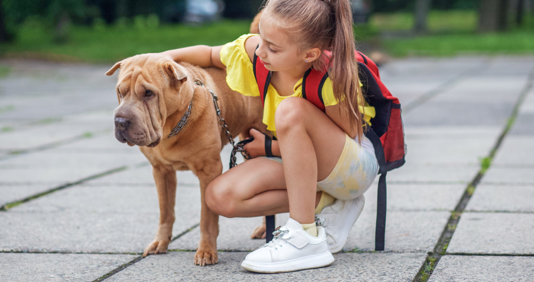 Girl with backpack and Dog