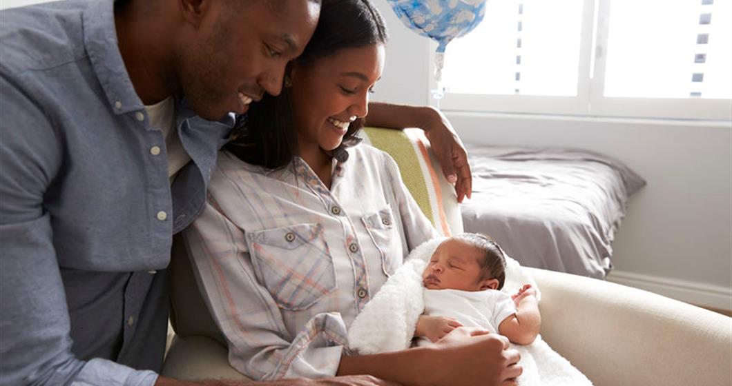 Couple holding newborn baby