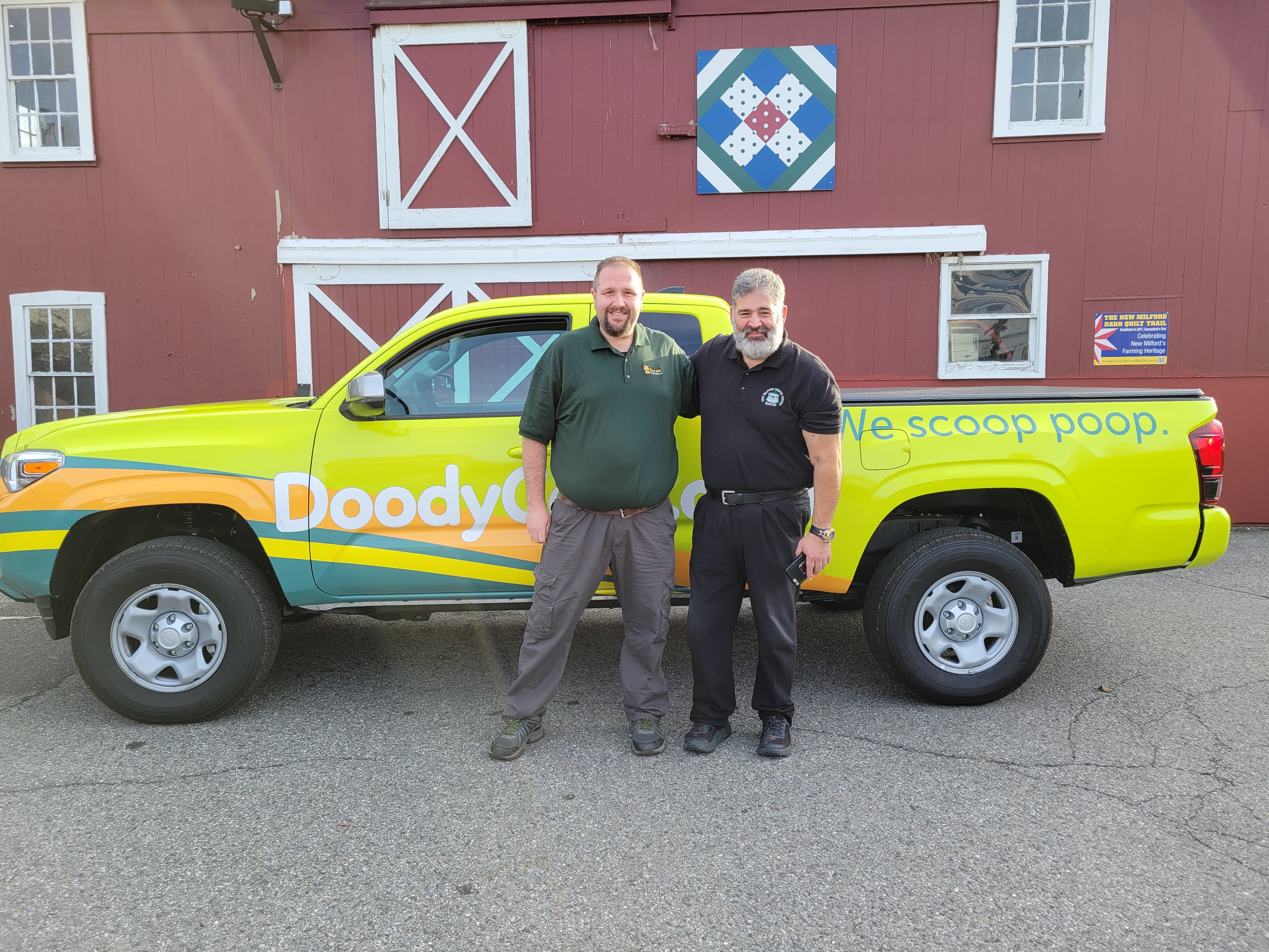 David Harvey & Mayor Peter Bass of New Milford CT standing in front of DoodyCalls of Western Connecticut service truck